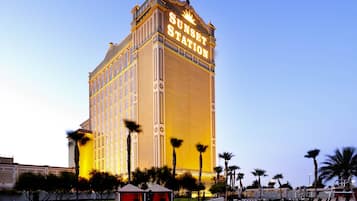 A large hotel with a prominent sign reading "Sunset Station."