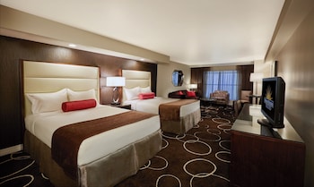 Petite Suite, 2 Queen Beds | Pillowtop beds, laptop workspace, blackout drapes, iron/ironing board at Sunset Station Hotel & Casino