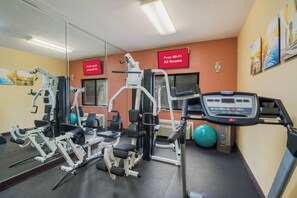 A gym with cardio equipment, weight machines, and a treadmill. - Red Roof Inn Fairfield (Fairfield)