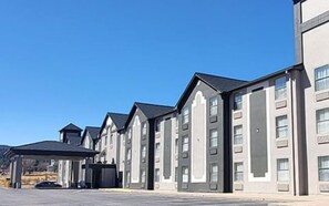 Stylish, multi-story buildings with a contemporary design and rectangular and arched windows.