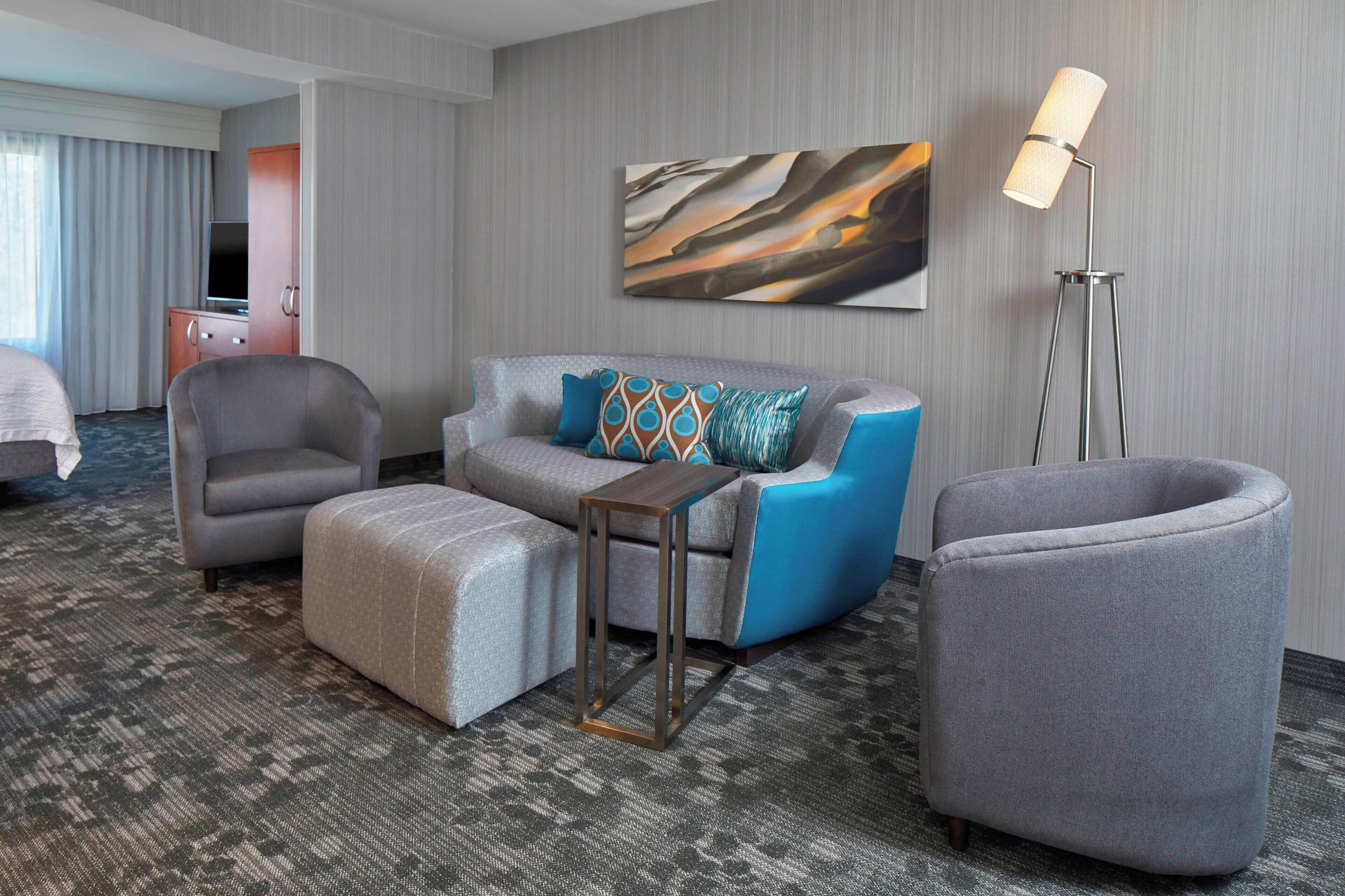 suite, 1 king bed with sofa bed | living area | lcd tv, pay films