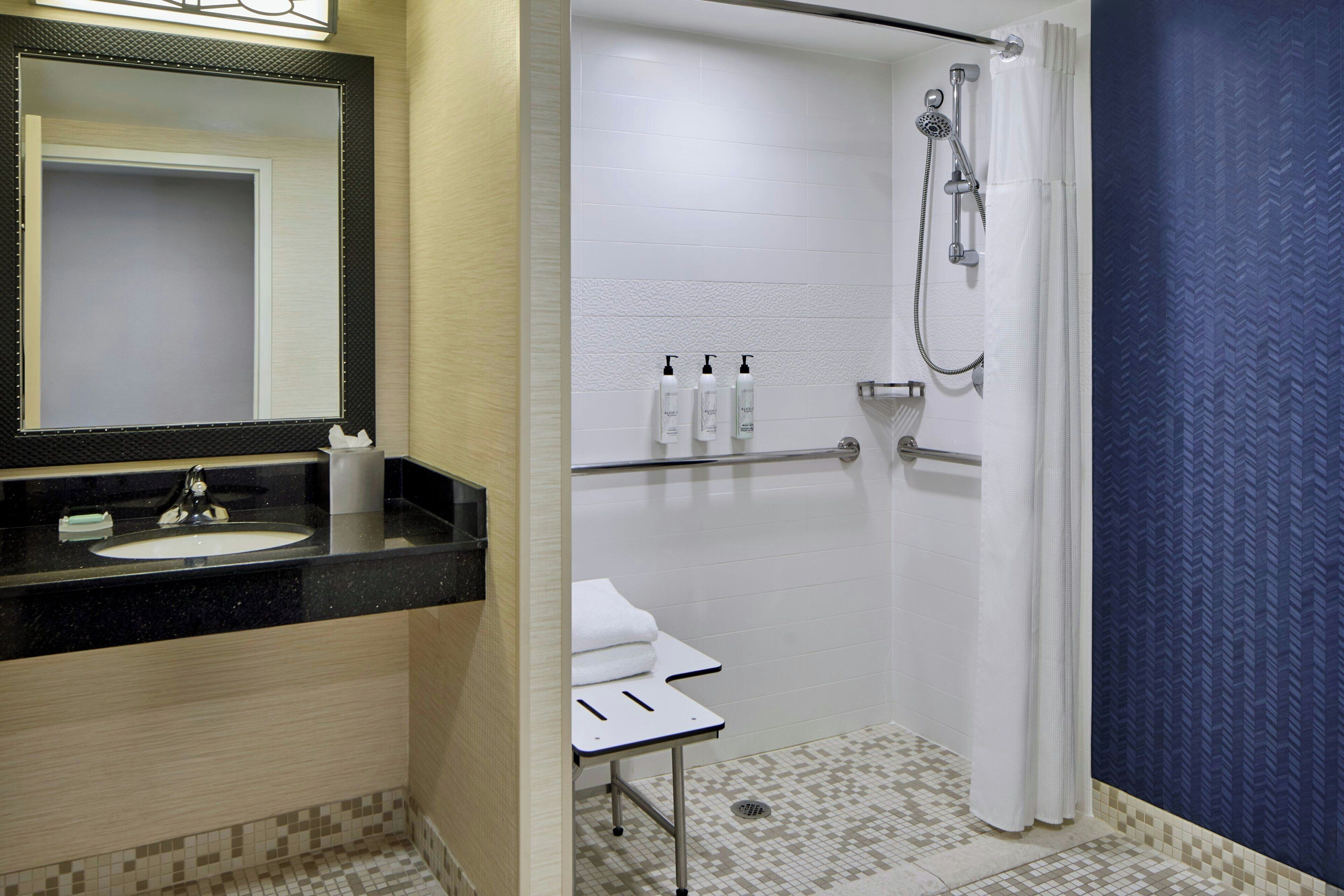 room, 1 king bed (mobility/hearing access, roll-in shwr) | bathroom | hair dryer, towels