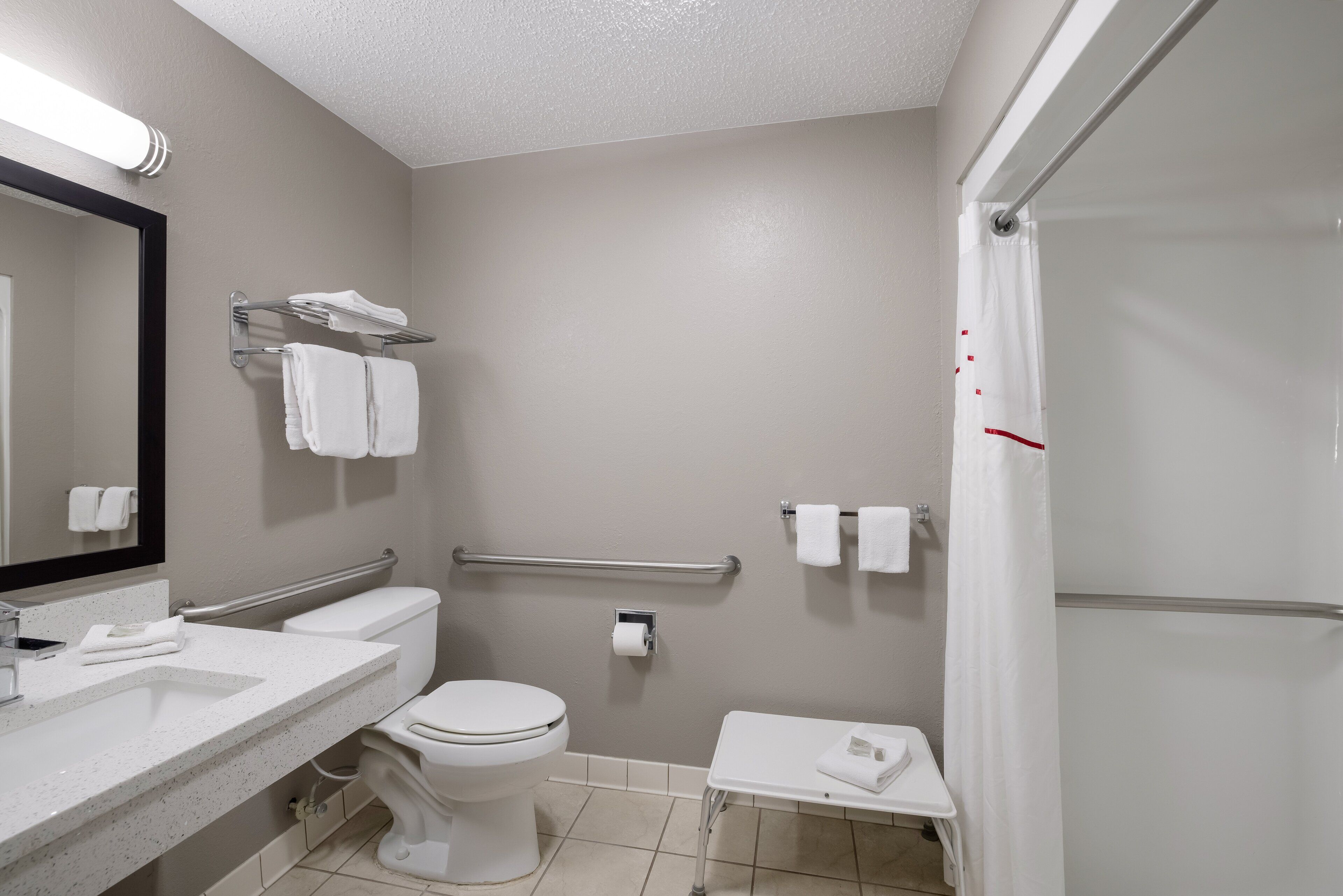 superior room, 1 king bed, accessible, non smoking (roll-in shower) | bathroom | hair dryer, towels, soap, shampoo
