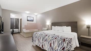 Superior Room, 1 King Bed, Non Smoking, Jetted Tub | Desk, laptop workspace, blackout drapes, iron/ironing board