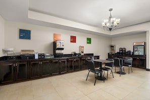 A hotel kitchen with a coffee station, a refrigerator, and a microwave. - Red Roof Inn Washington, NC (Washington)