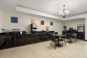 A hotel kitchen with a coffee station, a refrigerator, and a microwave. - Red Roof Inn Washington, NC (Washington)