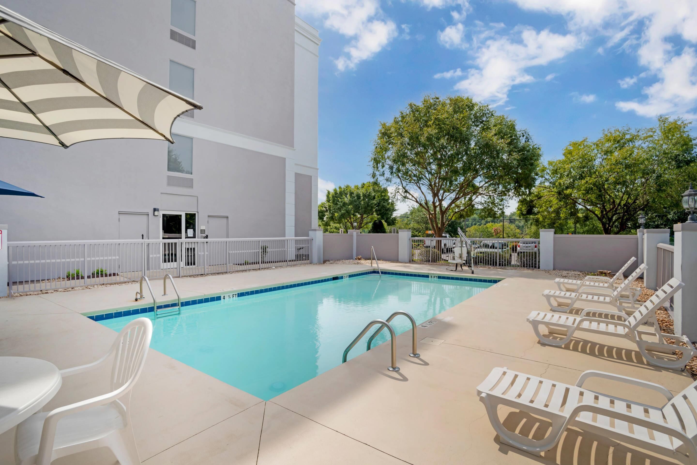 Seasonal outdoor pool, pool umbrellas, pool loungers