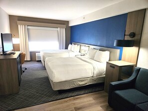 Premium bedding, desk, laptop workspace, blackout drapes