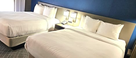 Premium bedding, desk, laptop workspace, blackout curtains