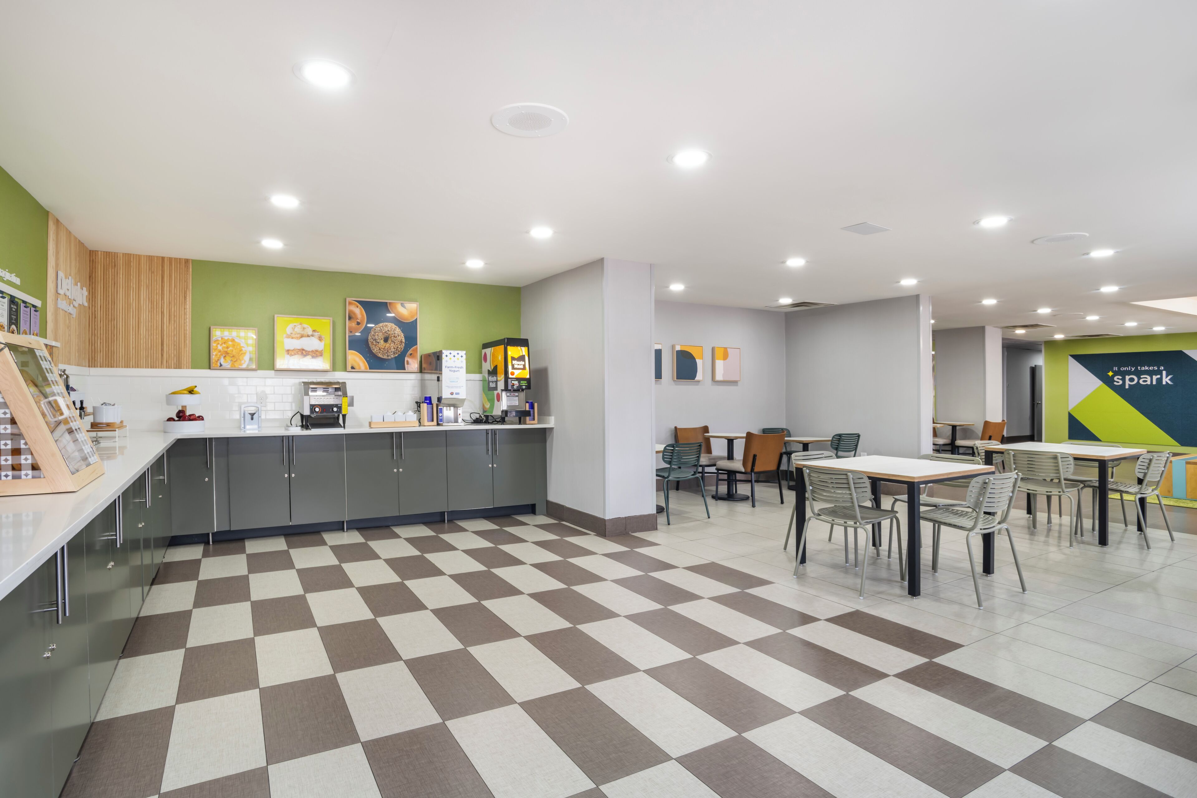 A modern kitchen with a checkered floor, a coffee machine, and a counter with various items.