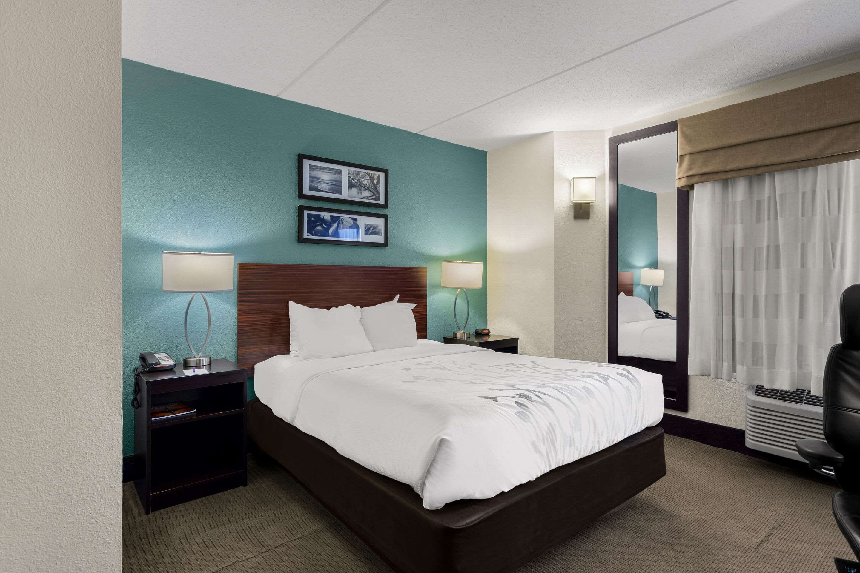 premium bedding, desk, laptop workspace, blackout curtains