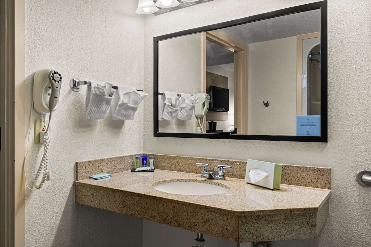 premium bedding, desk, laptop workspace, blackout curtains