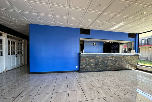 Welcome to the reception area, featuring a stylish counter and comfortable seating.