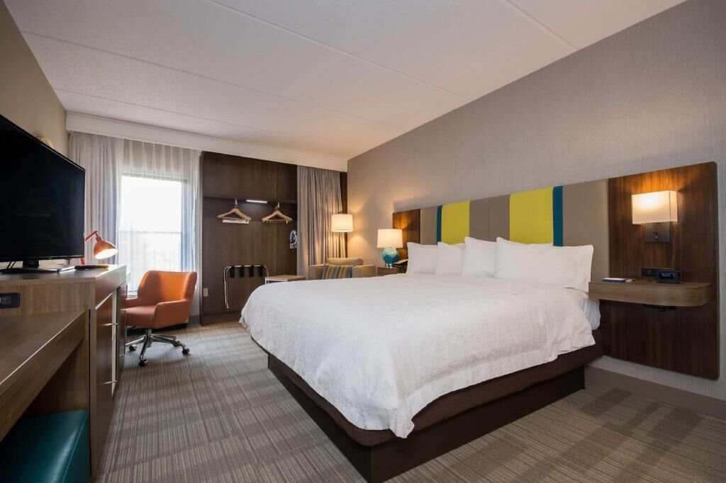 Roupas de cama premium, camas com colchões pillow-top, cortinas blackout