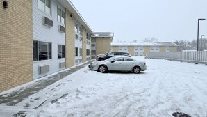 A building with a brick facade and multiple windows. - Bison Inn & Suites on University (Fargo)