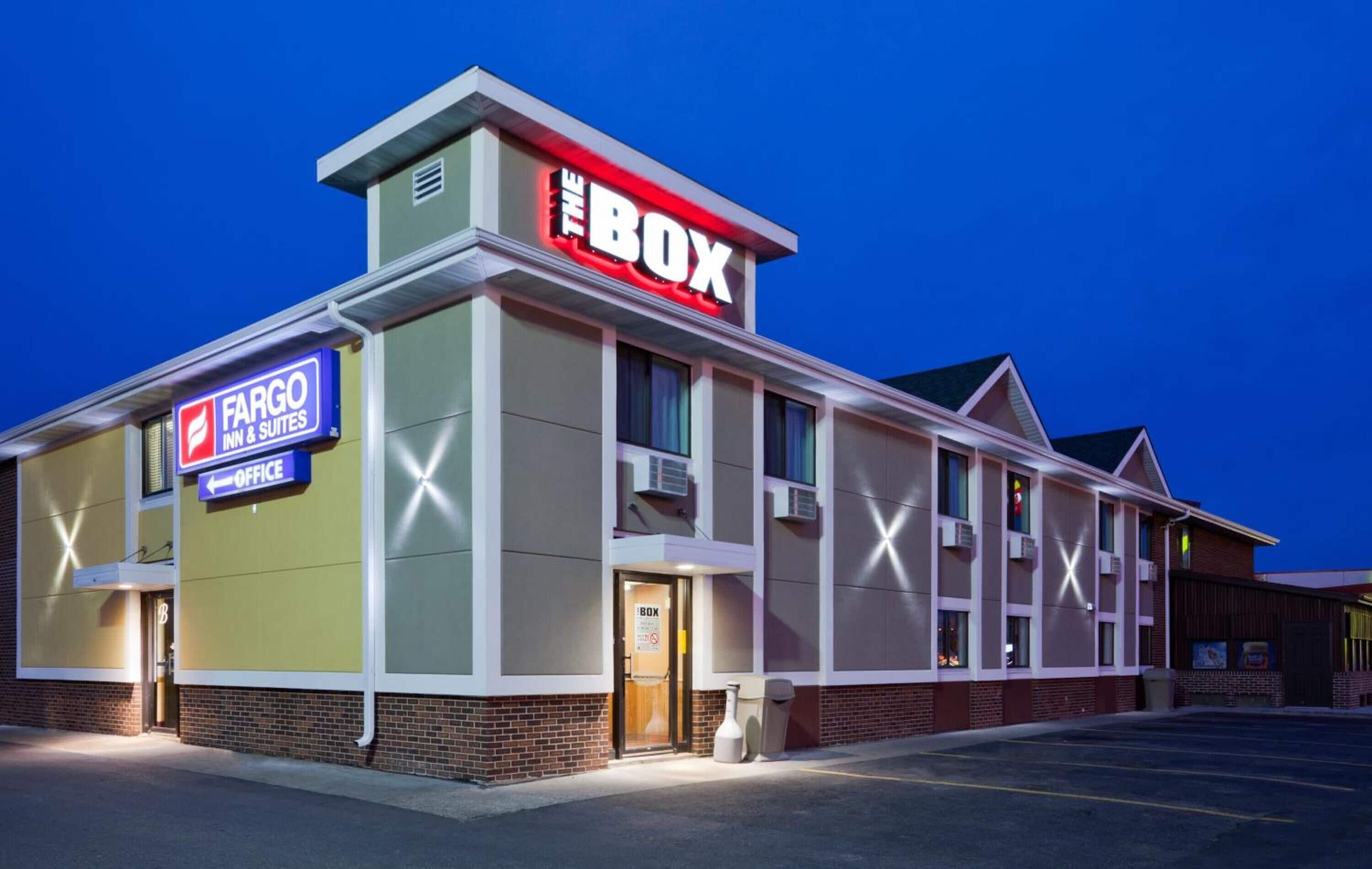 A building with a sign for 'The Box' and 'Fargo Inn & Suites' office.