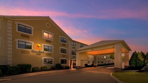 A Comfort Inn hotel with a covered entrance and a landscaped driveway.