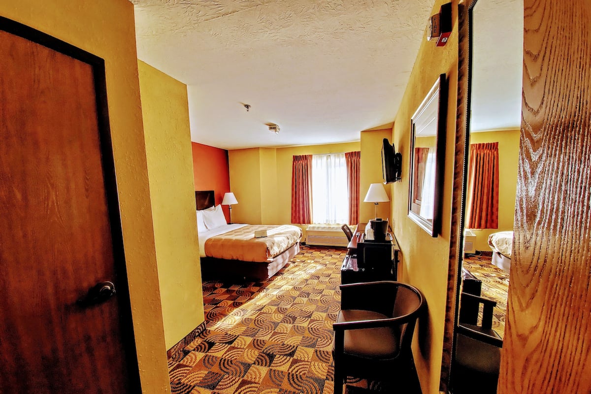 Desk, blackout drapes, iron/ironing board, rollaway beds