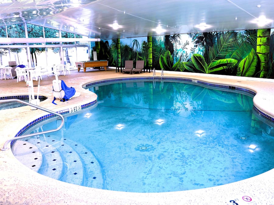 Indoor pool, open 8:00 AM to 11:00 PM, pool loungers