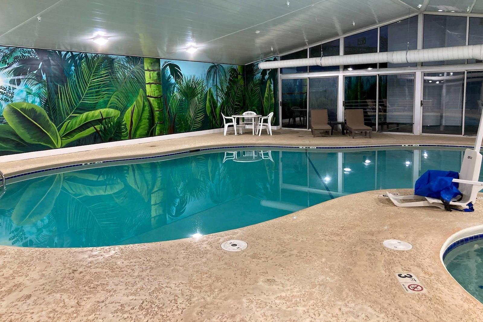 Indoor pool, open 8:00 AM to 11:00 PM, pool loungers