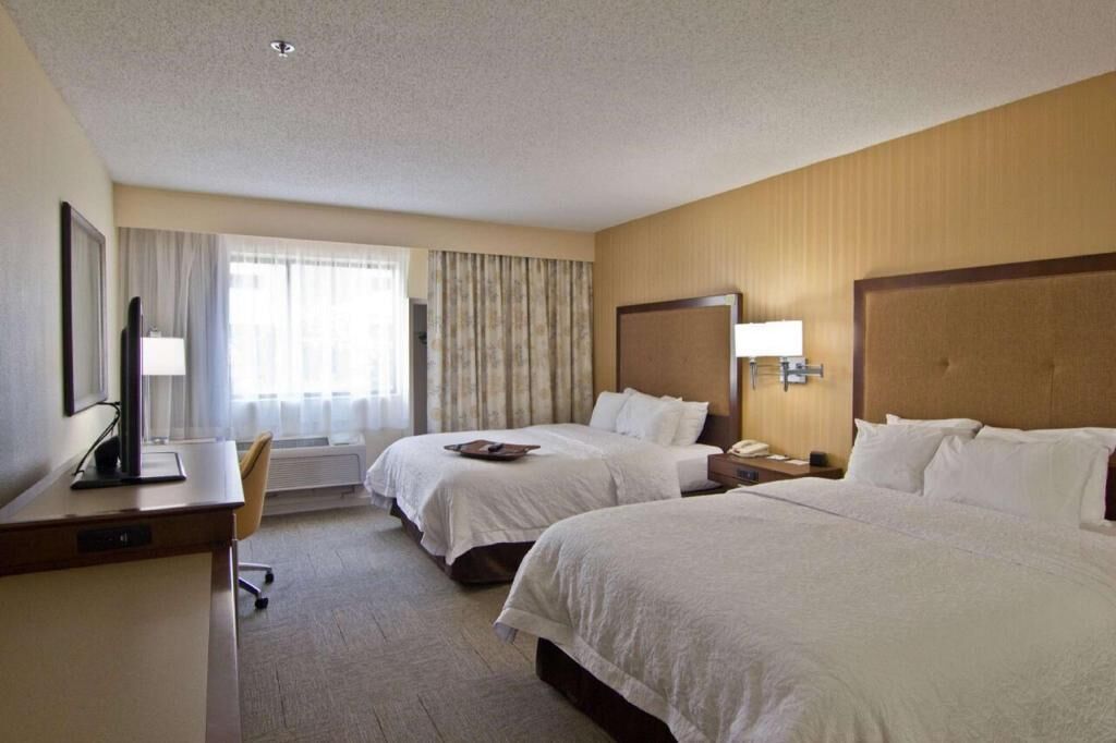 Premium bedding, pillow-top beds, desk, blackout curtains