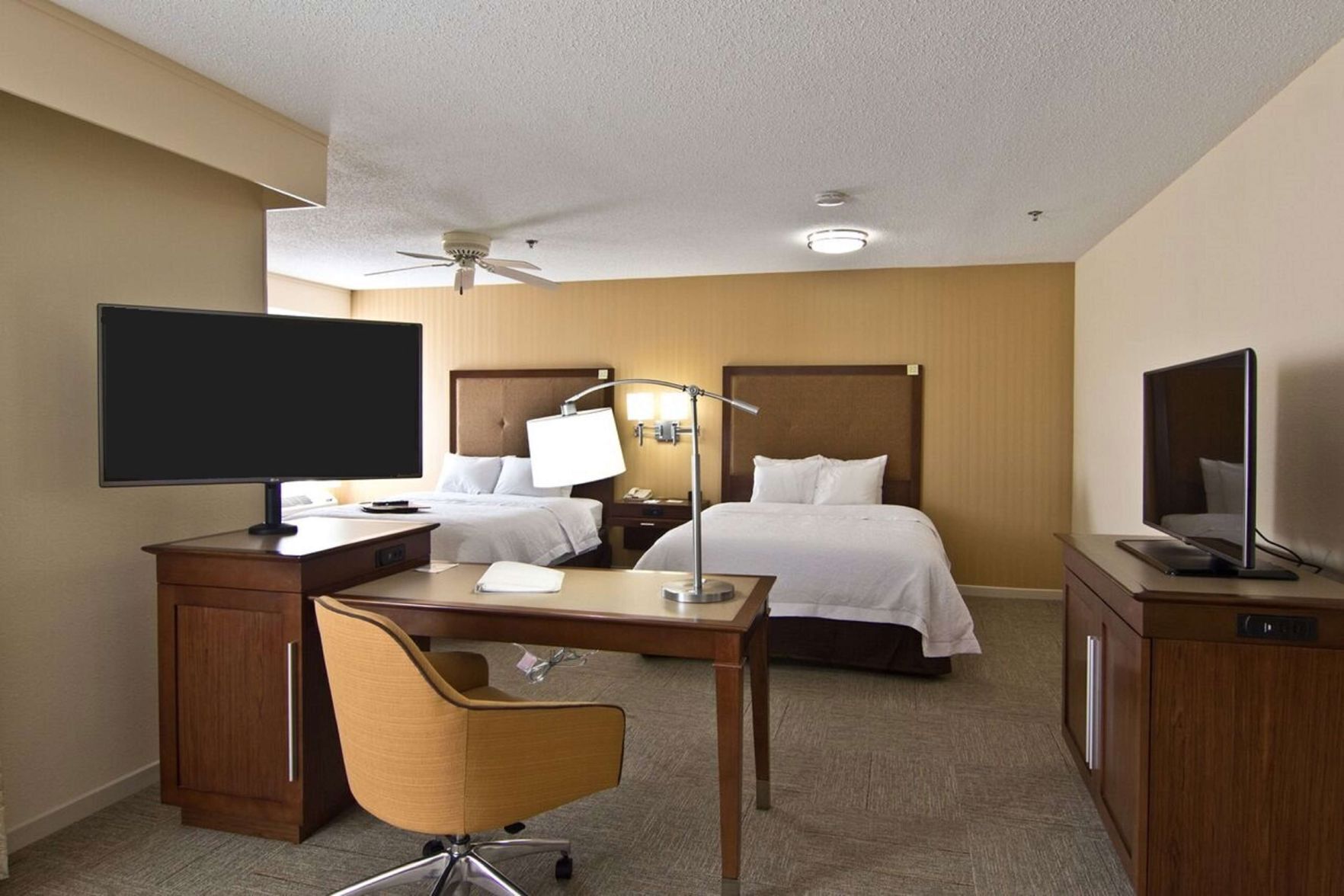 Premium bedding, pillow-top beds, desk, blackout curtains
