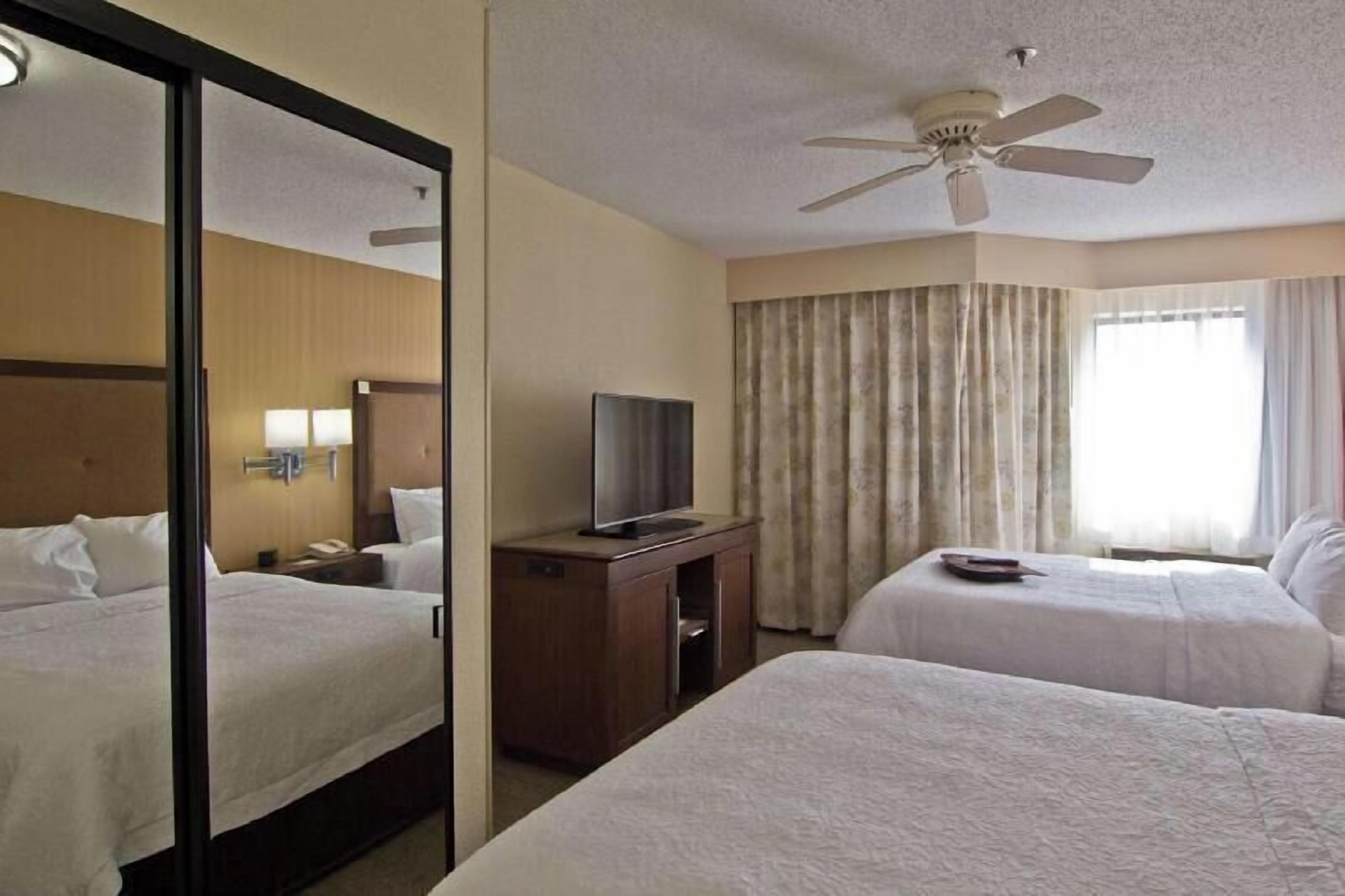 Premium bedding, pillow-top beds, desk, blackout curtains