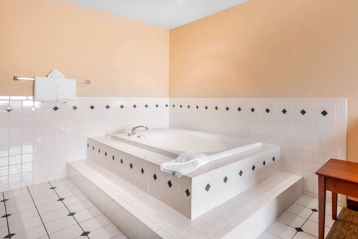 suite, 1 king bed, non smoking | in-room safe, desk, iron/ironing board, free cots/infant beds