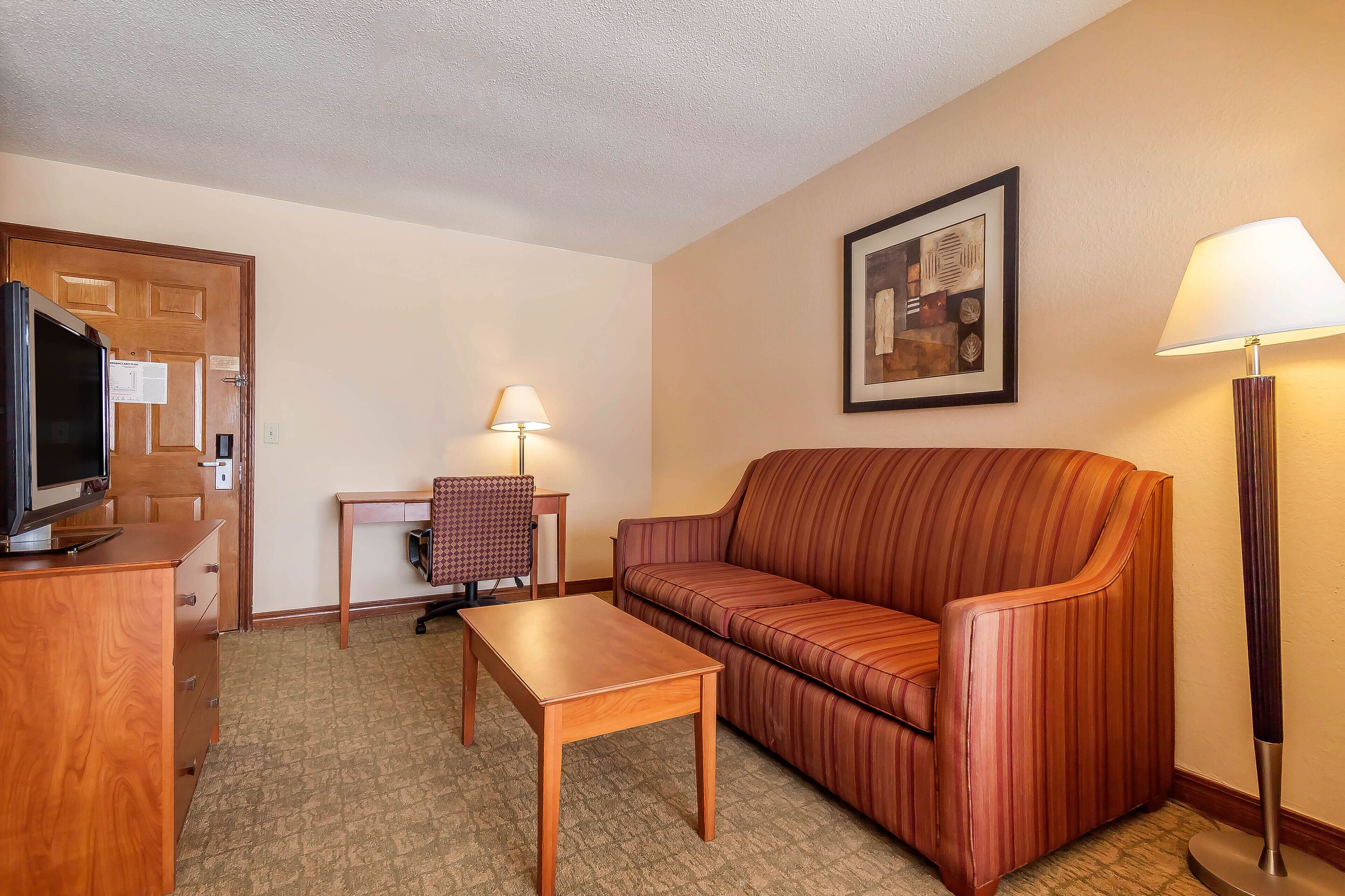 suite, 1 king bed, non smoking | in-room safe, desk, iron/ironing board, free cots/infant beds