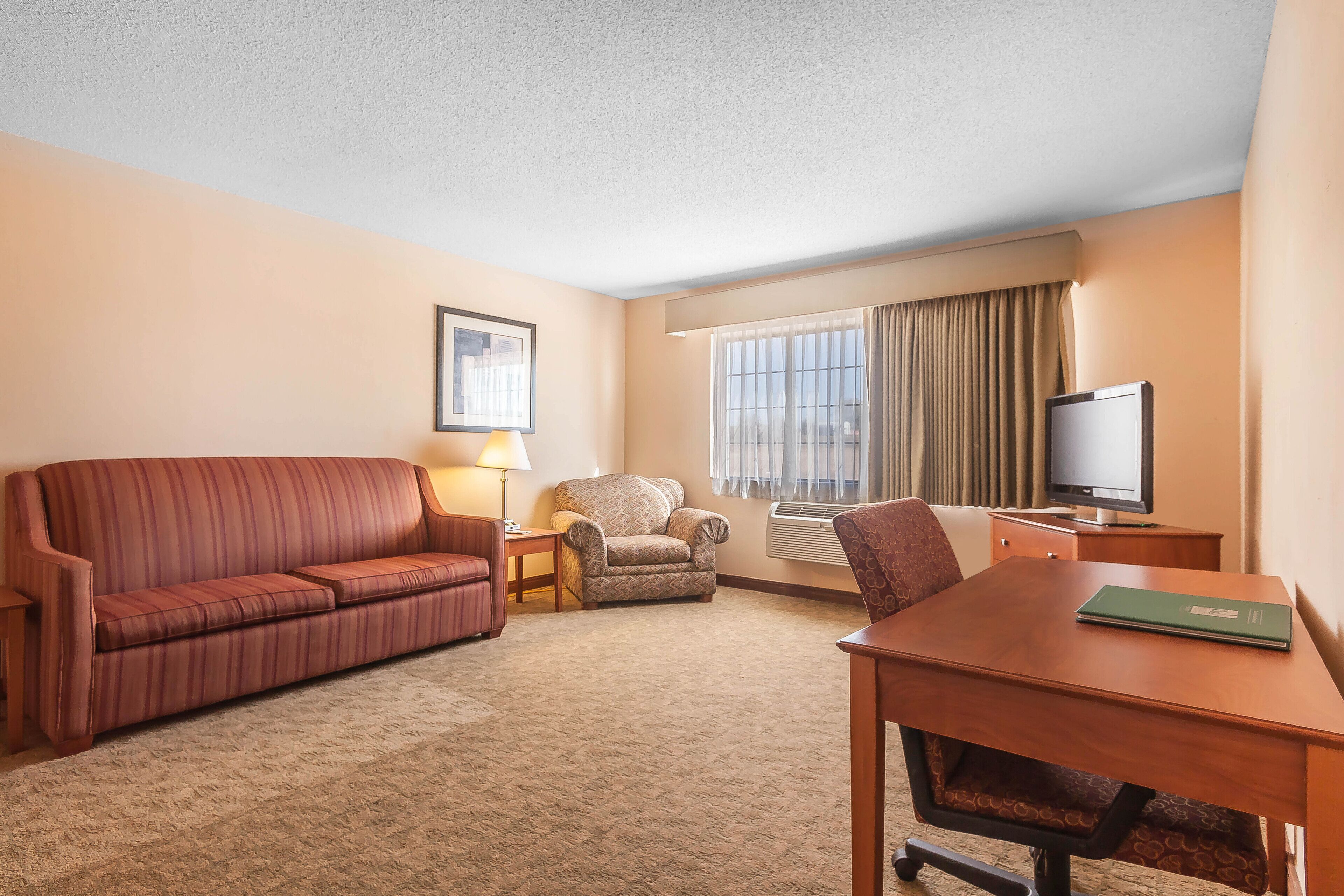 suite, 1 king bed, non smoking | in-room safe, desk, iron/ironing board, free cots/infant beds