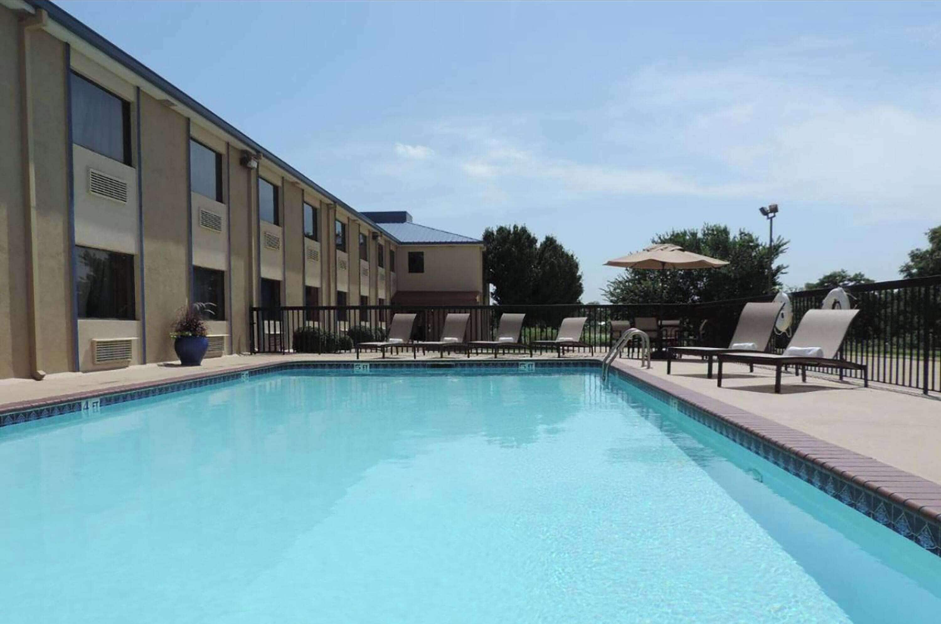 seasonal outdoor pool, open 9:00 am to 9:00 pm, pool loungers
