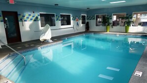 A swimming pool with numbered lanes, a towel rack, and a door marked "EXIT". - Best Western Sandy Inn (Sandy)
