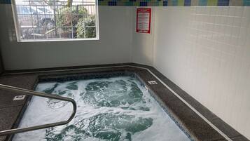 Relax in a hot tub with a view, accessible via a metal ladder.