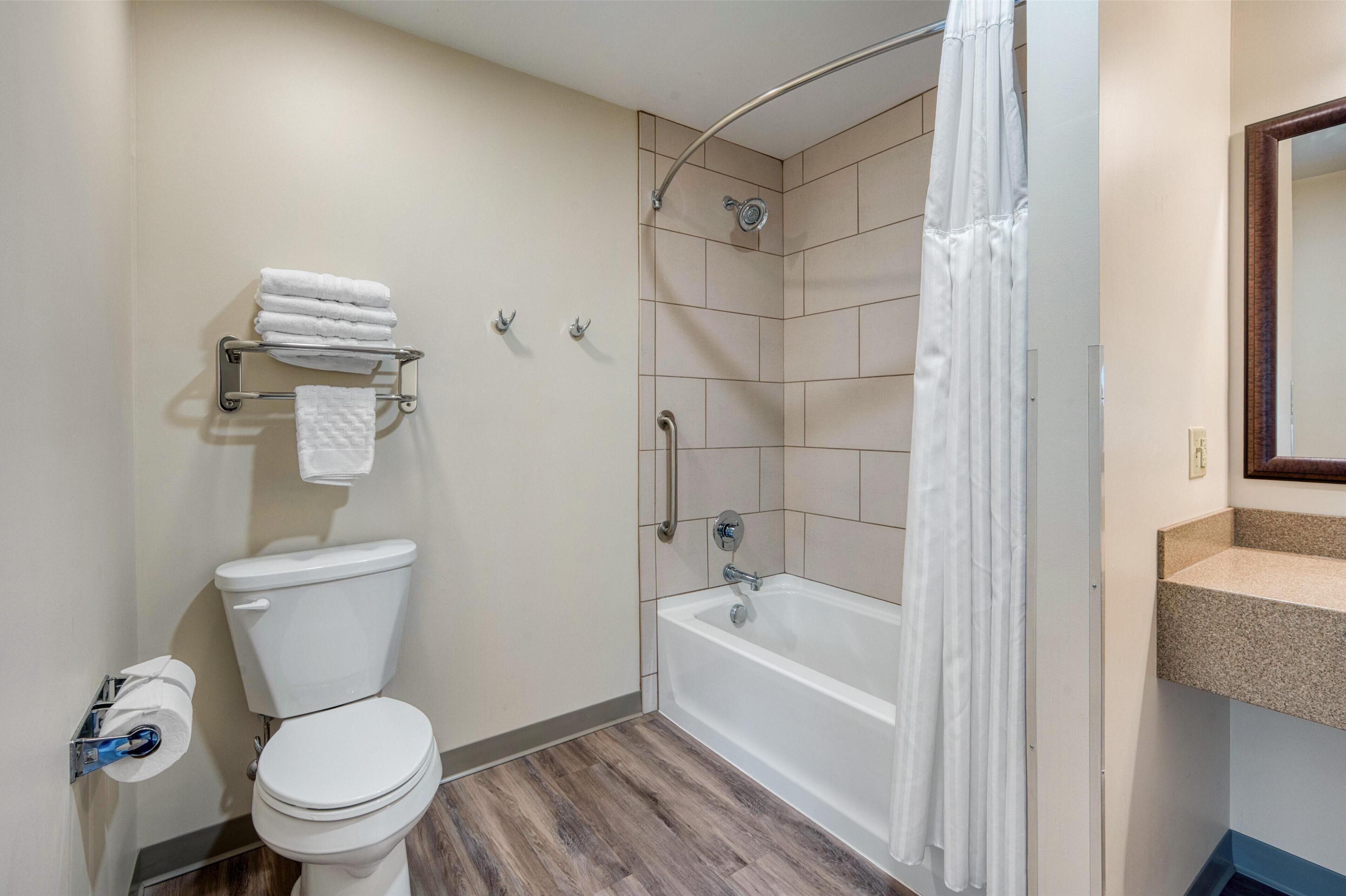 suite, 1 king bed, non smoking, refrigerator (queen murphy bed only with sofabed) | bathroom | combined shower/bathtub, eco-friendly toiletries, hair dryer, towels