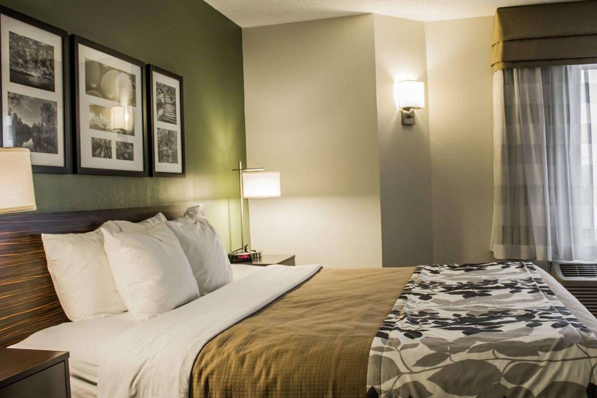 hypo-allergenic bedding, desk, laptop workspace, blackout curtains