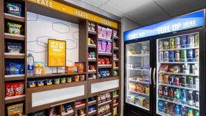 A snack and beverage display area with various snacks and drinks.
