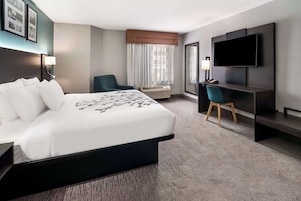 Desk, laptop workspace, blackout drapes, iron/ironing board