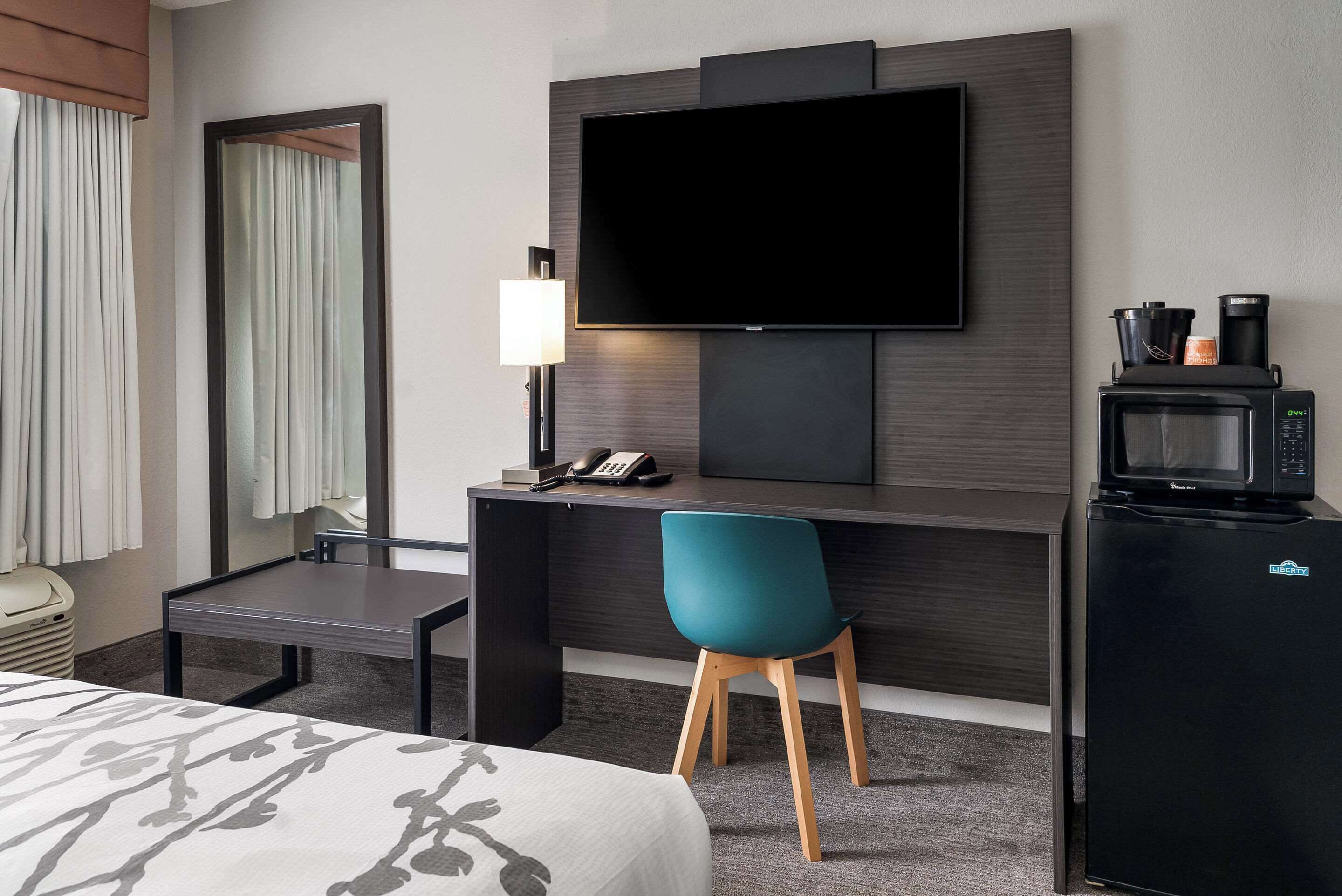 Desk, laptop workspace, blackout curtains, iron/ironing board