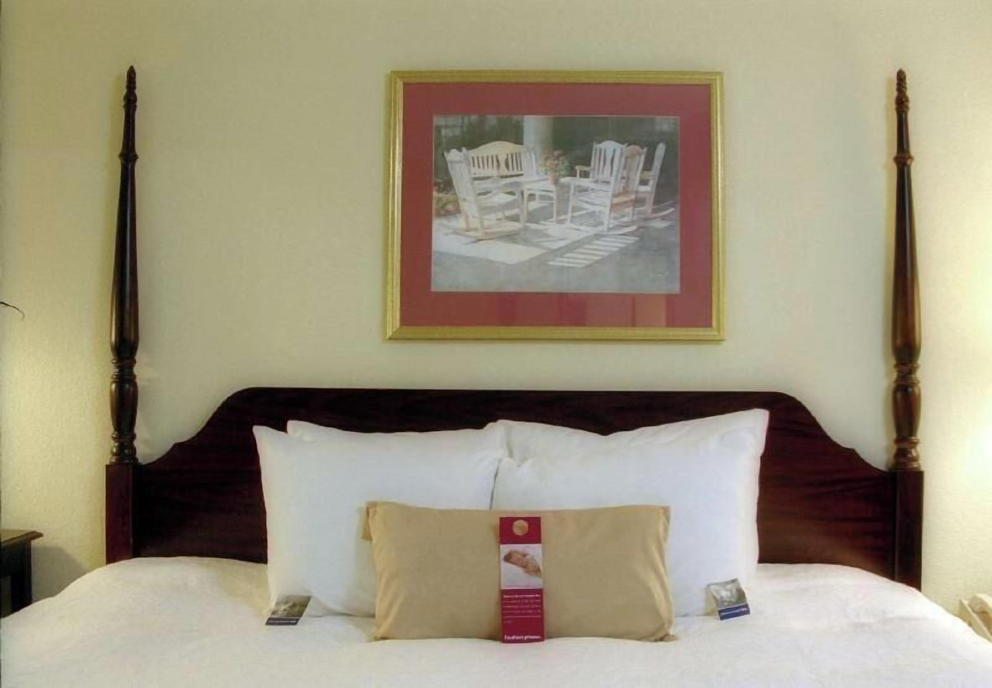Premium bedding, desk, laptop workspace, blackout drapes