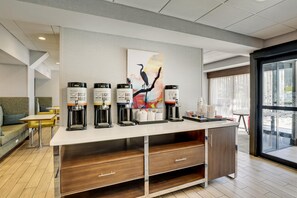 A modern coffee station with three coffee dispensers labeled Decaf Roast, Light Roast, and Dark Roast. - Hampton Inn Beaufort (Beaufort)