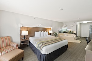 Escritorio, cortinas blackout y tabla de planchar con plancha