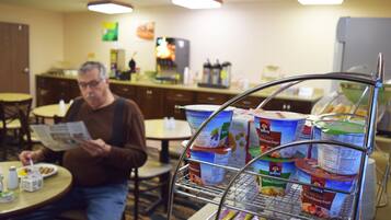 Guests can enjoy a meal at the hotel's dining area, which features a buffet with a variety of food and beverages.