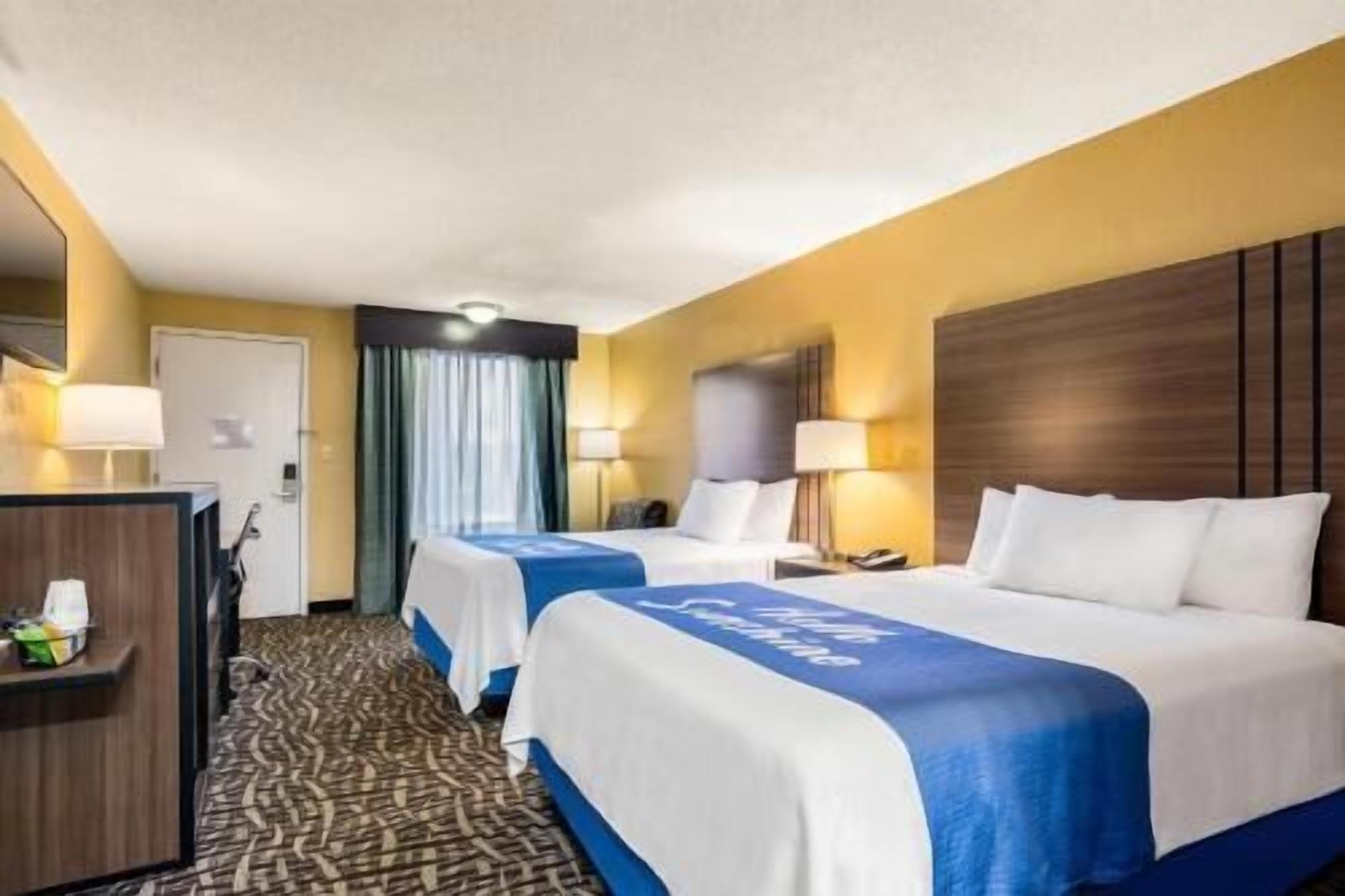 Premium bedding, desk, laptop workspace, iron/ironing board
