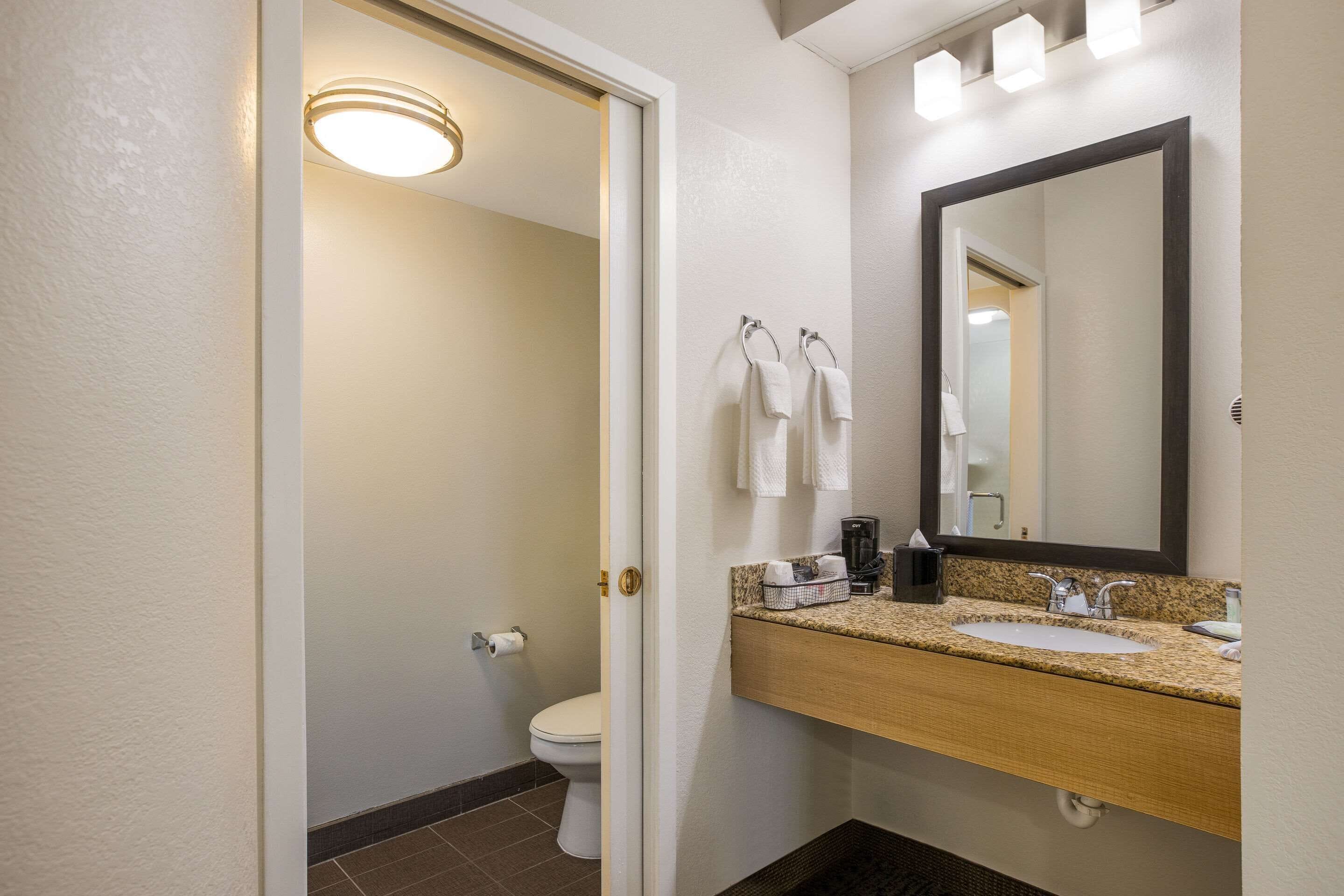 premium bedding, desk, blackout curtains, iron/ironing board