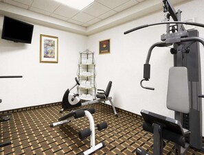 Stay active on your travels with a fully equipped fitness room featuring a range of exercise equipment and a TV for entertainment.
