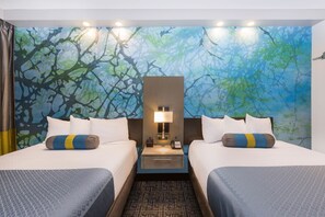 A hotel room with two beds, a nightstand with a lamp, and a wall mural. - Wingate by Wyndham Goodlettsville (Goodlettsville)