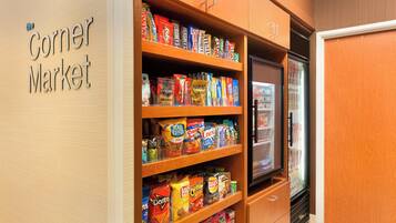 A snack display in a store with a sign reading "Corner Market".