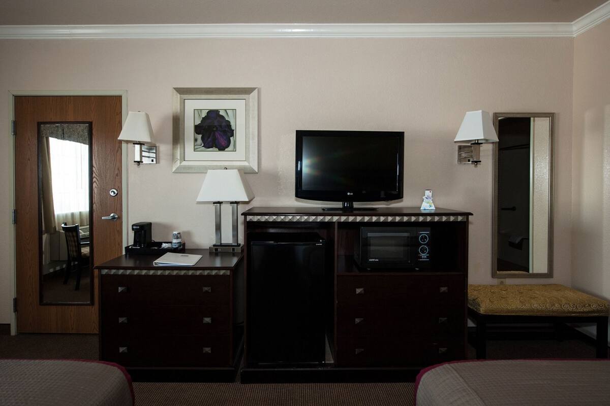 Desk, laptop workspace, blackout curtains, iron/ironing board