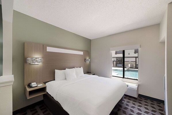 Premium bedding, pillow-top beds, desk, laptop workspace