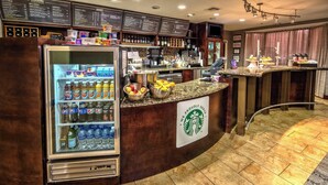 A Starbucks coffee shop with a refrigerated display case, a menu board, and a variety of beverages and food items. - Courtyard by Marriott Abilene Southwest/Abilene Mall South (Abilene)